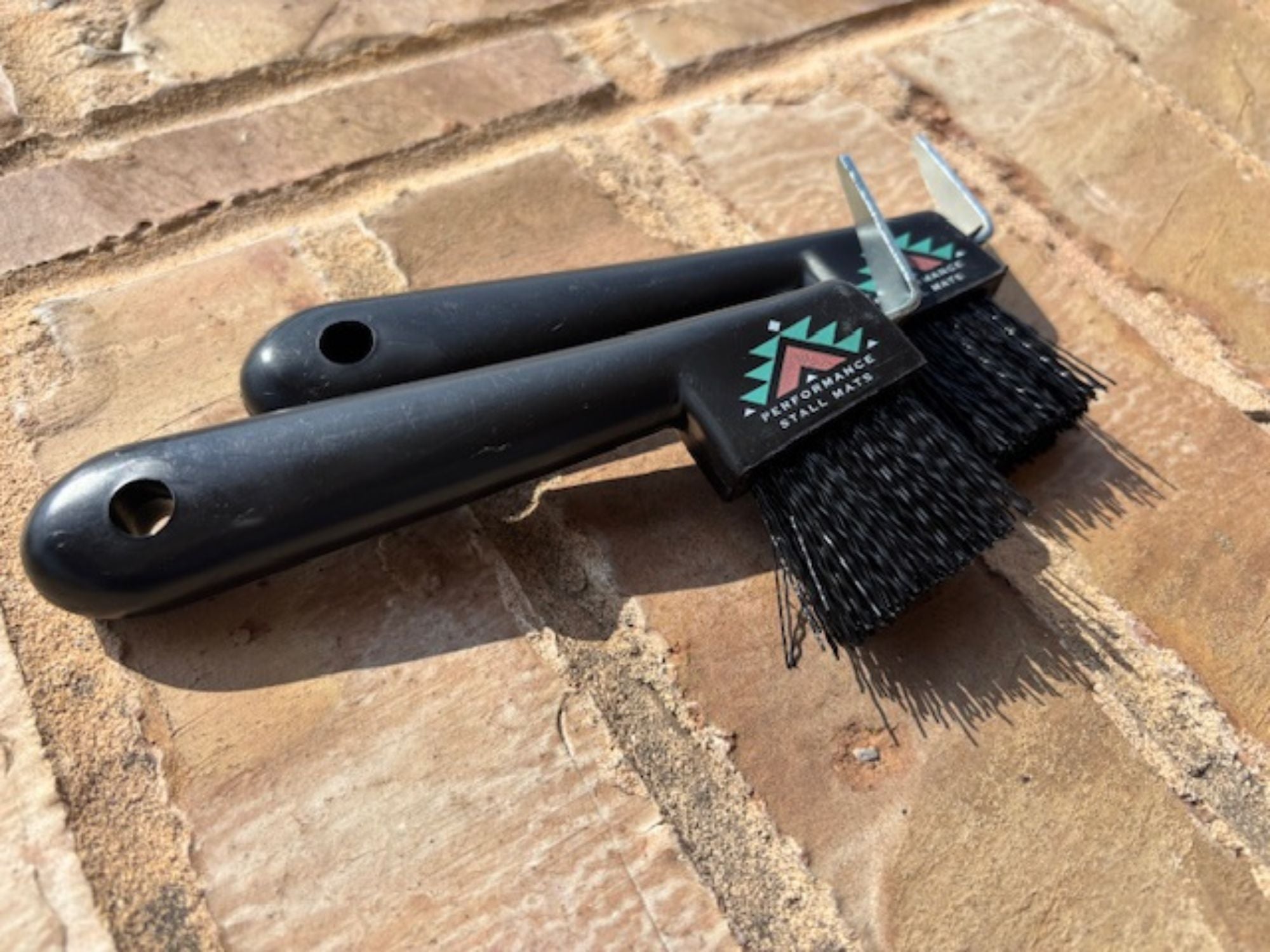 black hoof pick with brush
