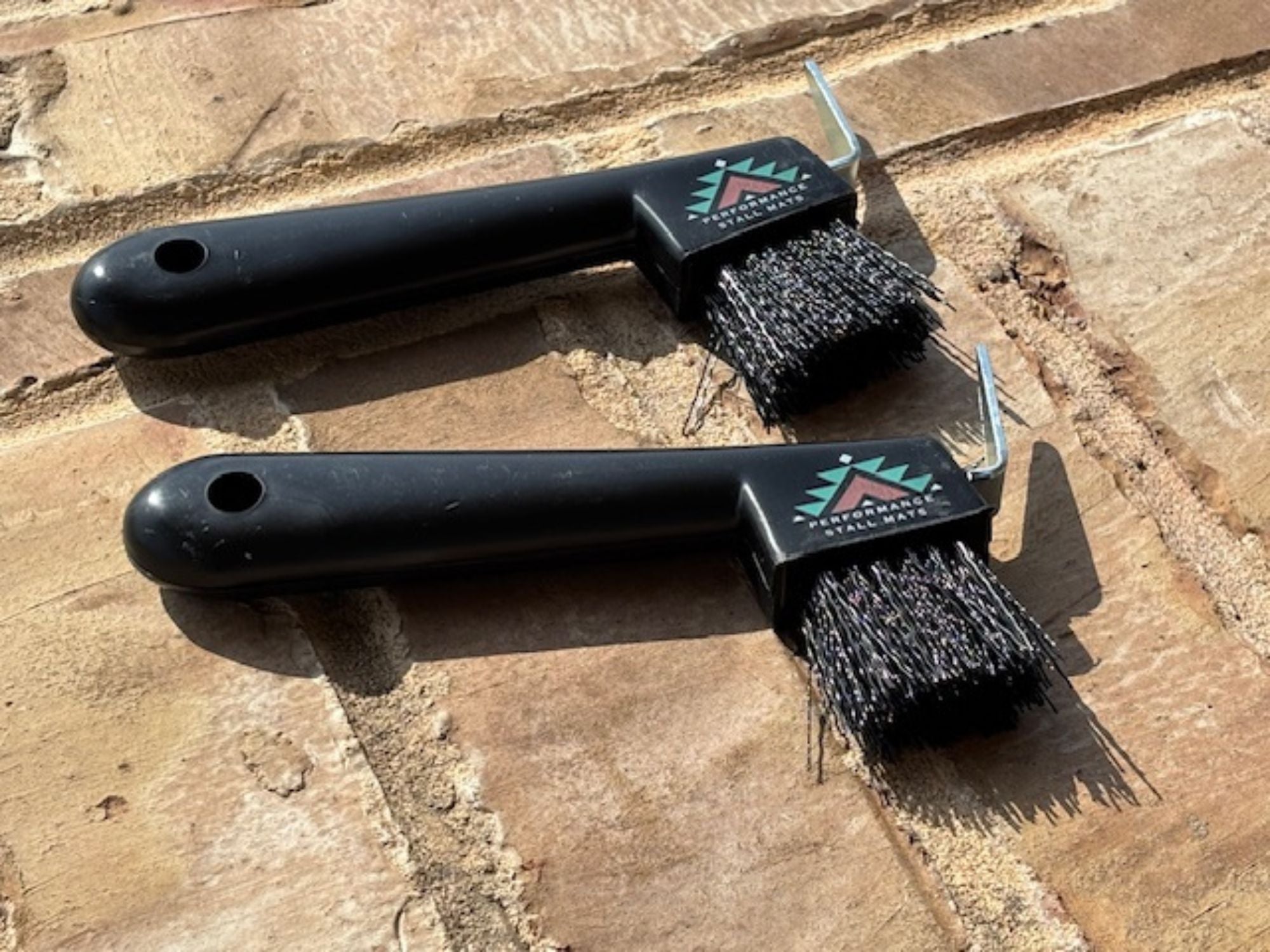 black hoof pick with brush